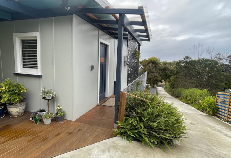 Front door, lockbox and driveway.